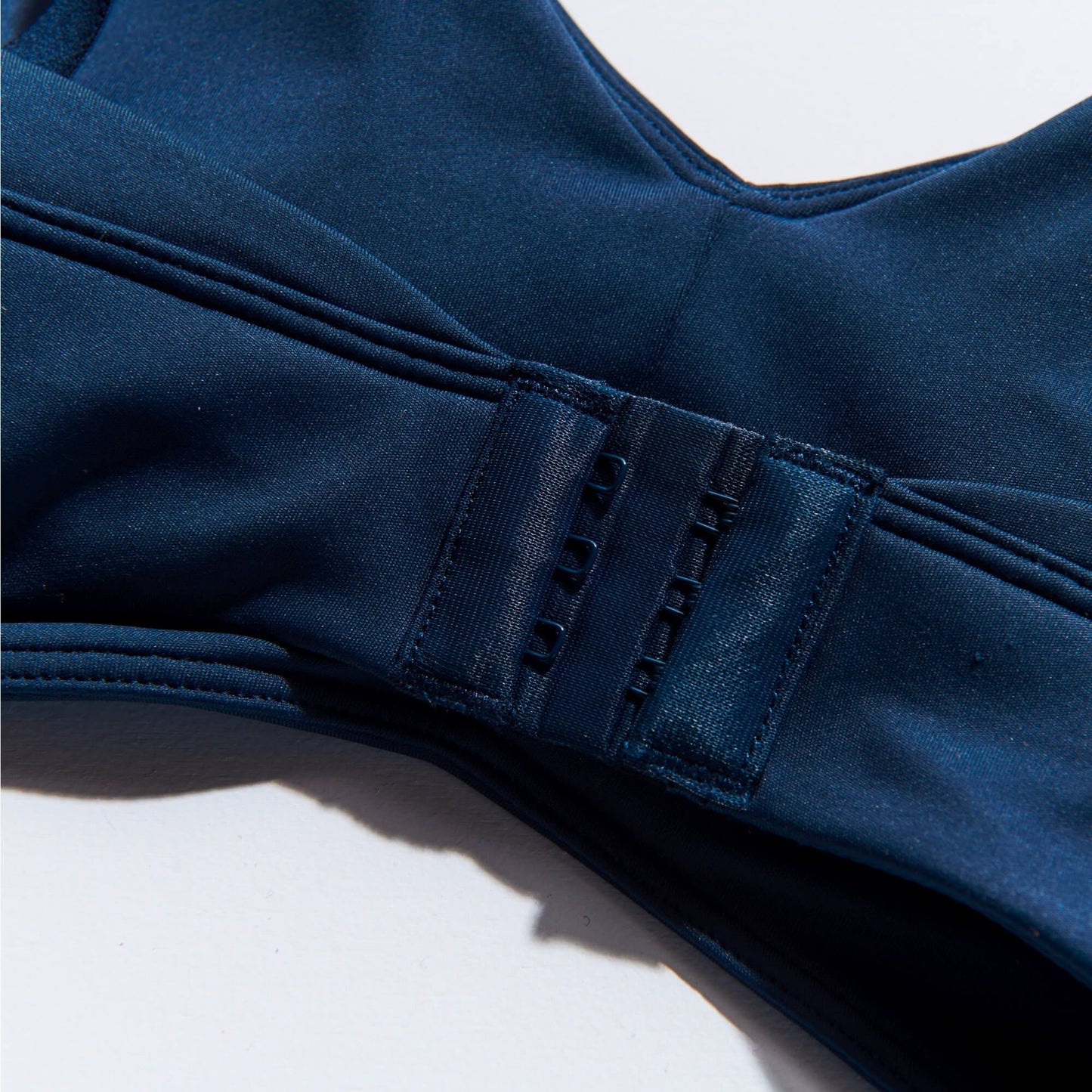 Close up of Navy NipCo Maternity Bra to show fastening and clasps