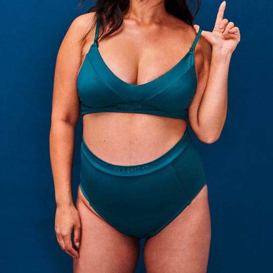 Model snaps her NipCo Maternity Bra and wears matching High Waisted Briefs in Teal